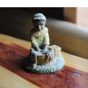 All God's Children" figurine by artist Martha Holcombe.